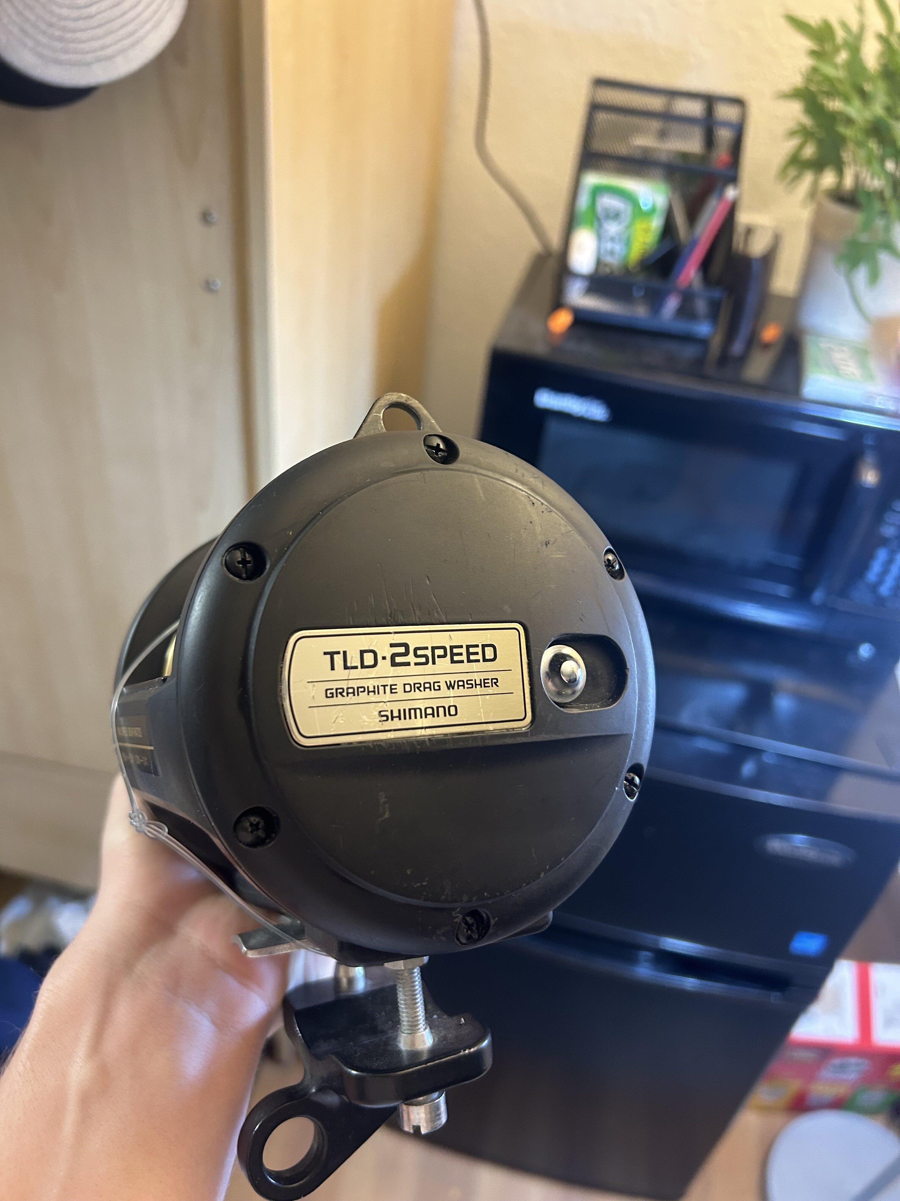 Two-speed trolling reels mounted on heavy offshore rods in a boat's rod holders