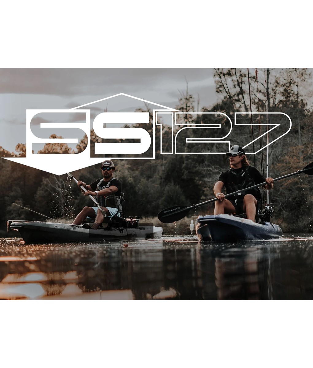 Bonafide SS127 fishing kayak on the water with angler standing and casting