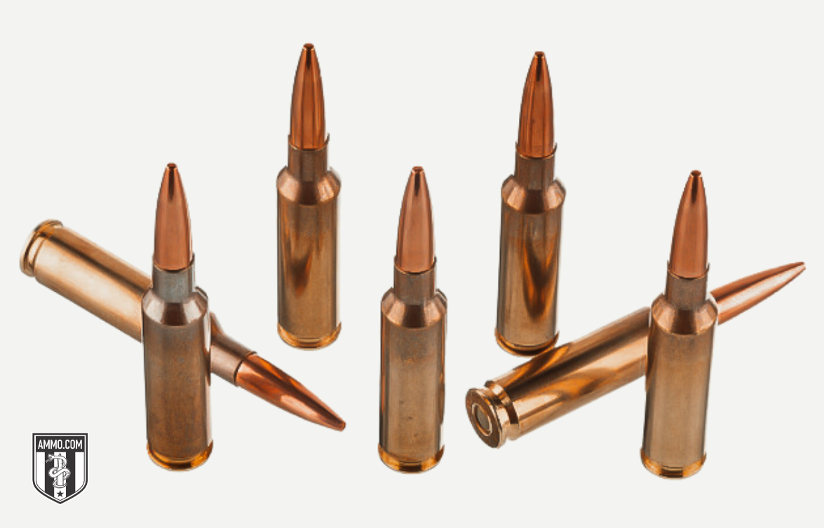 6.5 Creedmoor and .308 Winchester cartridges side by side on a shooting bench