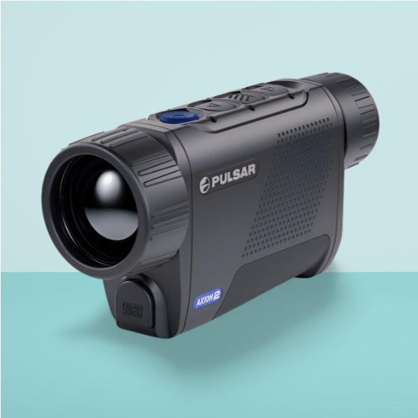 Pulsar Axion 2 XQ35 Pro thermal monocular handheld in a field