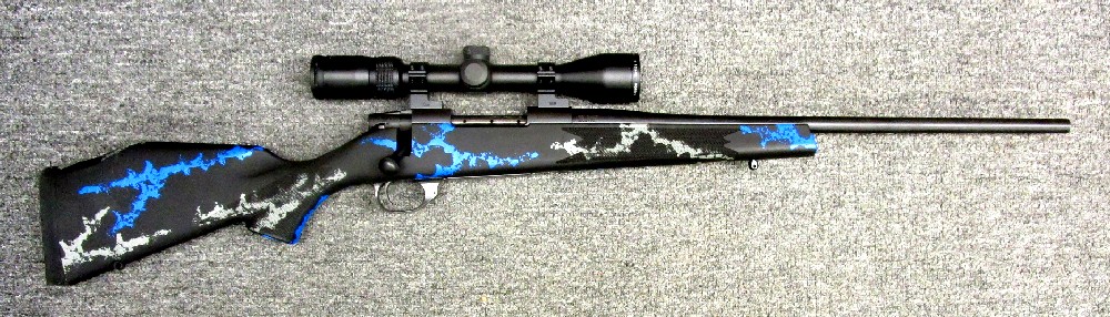 Weatherby Vanguard bolt-action rifle in a hunting field